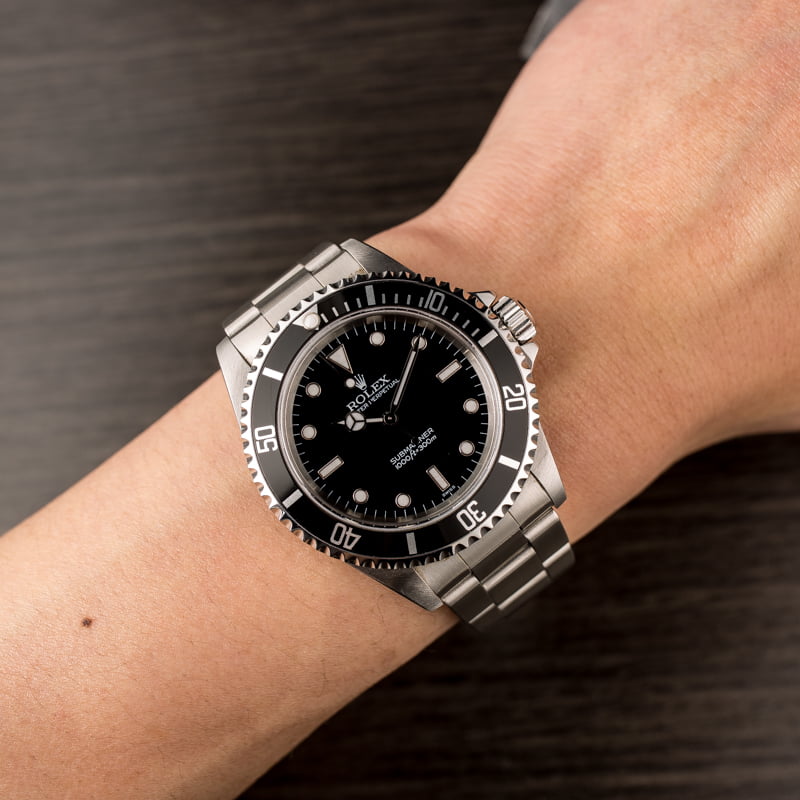 PreOwned Rolex Submariner 14060 Black Timing Bezel