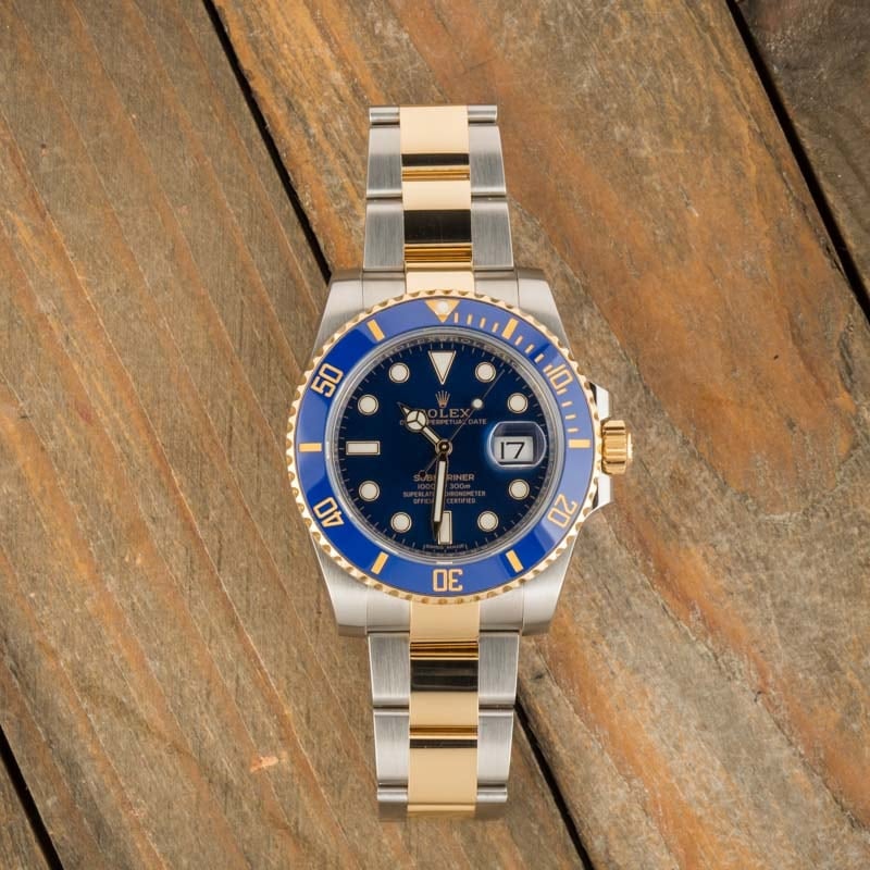 Rolex blue face hot sale gold band