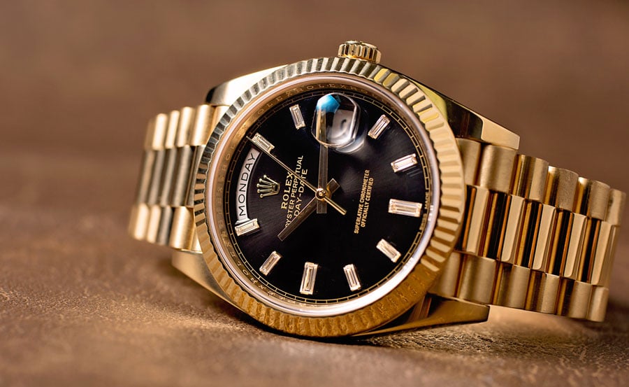 rolex oyster perpetual day date gold black face