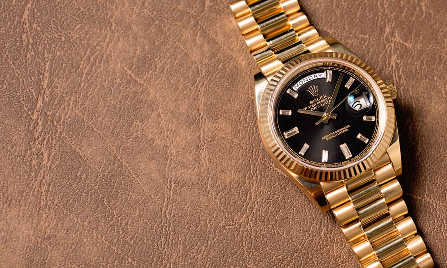 rolex day date 40 yellow gold black dial