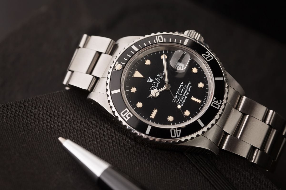 How Much Is a Rolex Submariner Prices Guide 16610 black tritium dial
